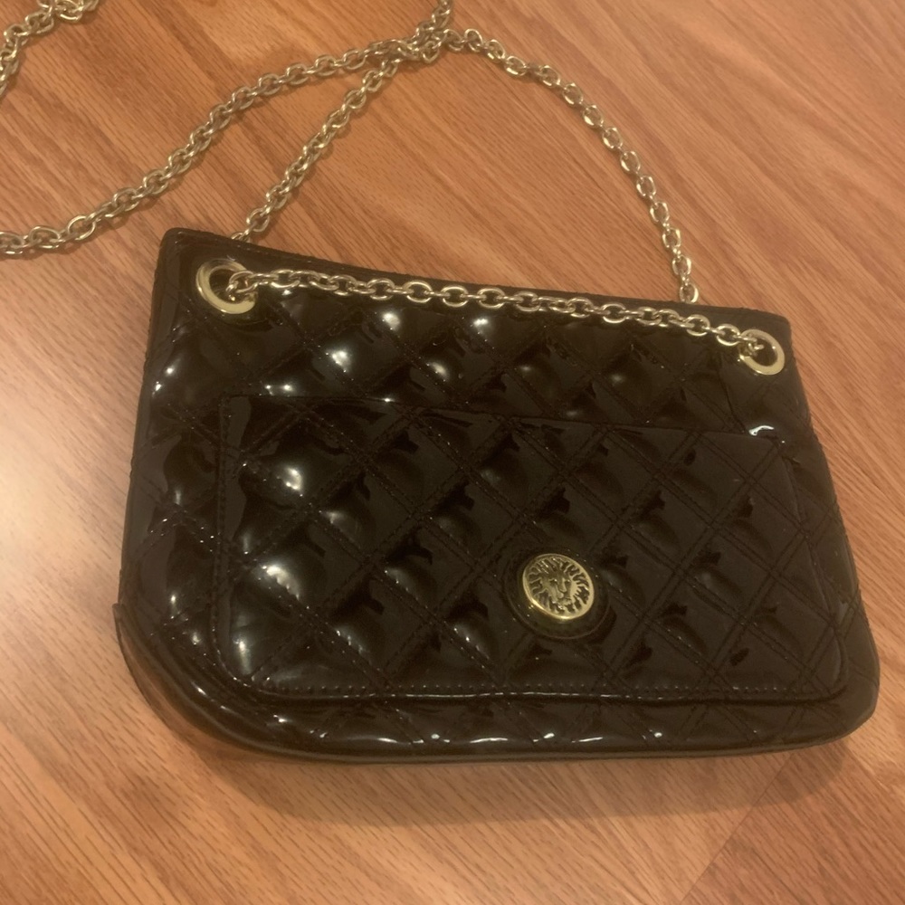 Black cross body chain strap purse.